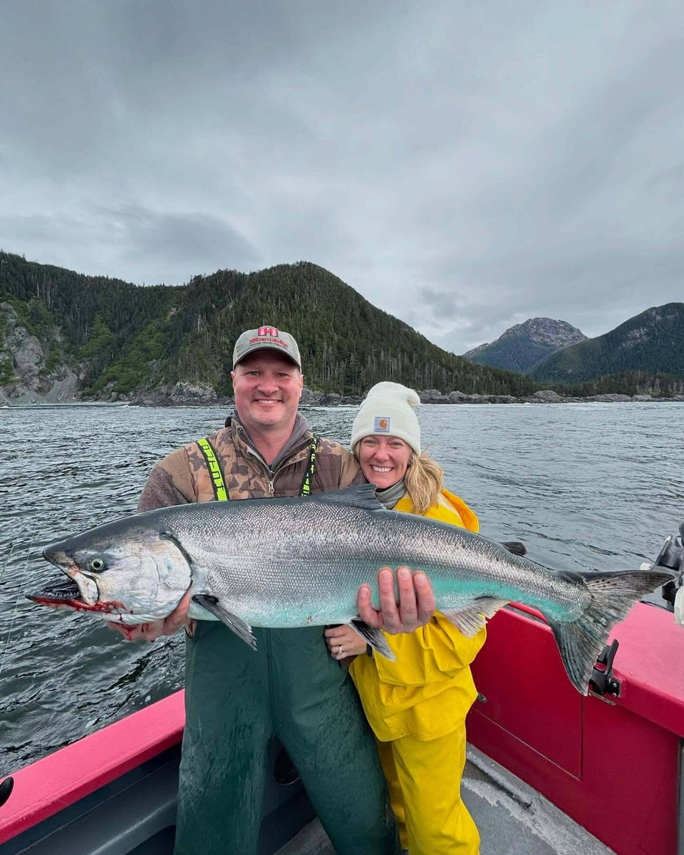 Salmon Fishing in Sitka, Alaska - A happy couple with a big salmon that they caught with Horizon West Fishing Adventures